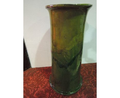 A substantial early 20th century C H Brannam Barum ware stick stand/jardini¦re stand with mottled green glaze, with incised s