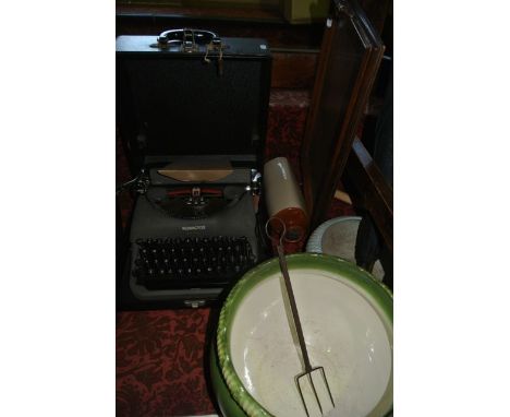 A vintage cased Remington typewriter together with a ceramic jardinière with moulded shell bordered rim, a 19th century oak d