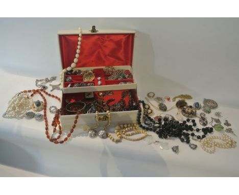 A jewellery box containing a miscellaneous collection of costume jewellery, including: an imitation jet bead necklace, an imi