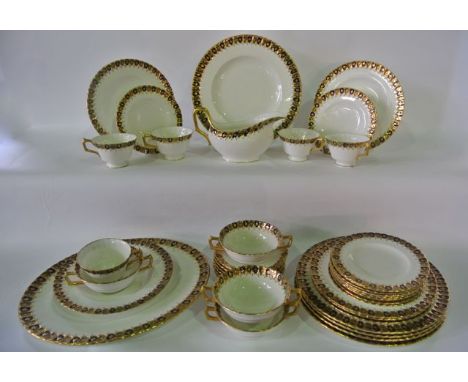 A collection of Royal Crown Derby dinner and tea wares with blue and gilt border decoration comprising oval meat plate, sauce