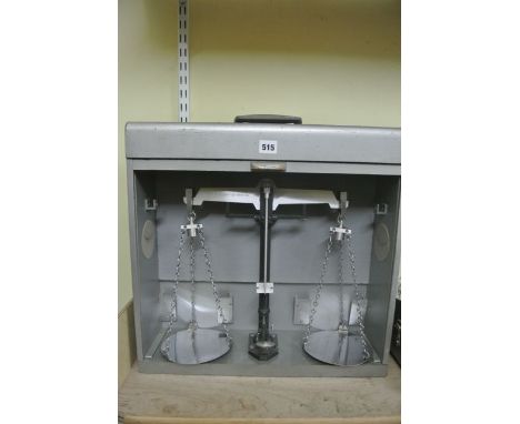 A cased set of travelling beam scales to weigh 5kg engraved City & County of Bristol, set within a tambour fronted case