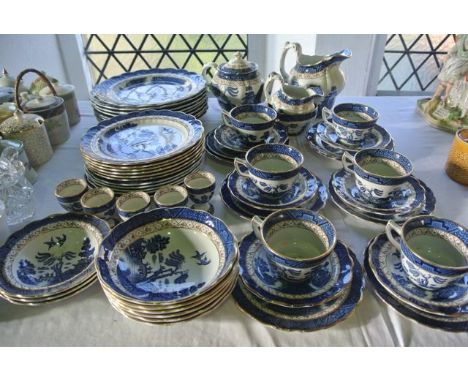 A quantity of Booths Real Old Willow pattern blue and white printed dinner and tea wares including teapot, milk jug, sugar bo