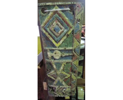 A timber panel, believed to have originated from an Egyptian dhow with brightly coloured geometric painted detail