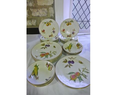 A collection of Royal Worcester Evesham pattern oven-to-table wares comprising nine dinner sized plates, twelve dessert or si