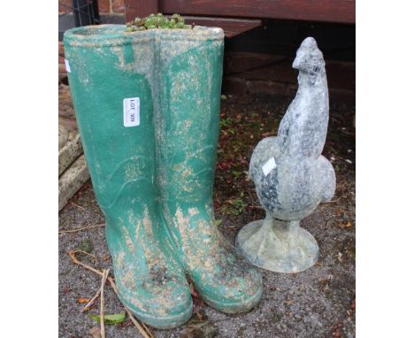 A cast garden planter in the form of wellies together with a chicken ornament&nbsp;