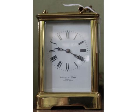 A Mappin and Webb London, a brass cased chiming carriage clock, white enamel dial with Roman Numerals, (complete with key)