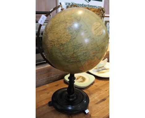 A Philips 12" terrestrial globe, Browne & Nolan, Dublin, c.1900, on ebonised stand  Condition: The globe is discoloured with 