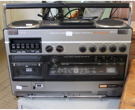 A portable Hitachi stereo player / recorder with lead