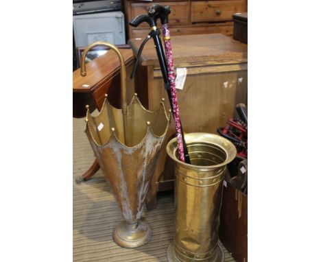 Two metal stick stands one shaped as an umbrella&nbsp;
