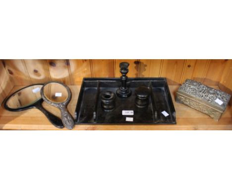 A shelf containing an ebonised wood desktop tray, two hand mirrors and a metal box&nbsp;