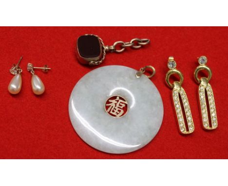 A Chinese Jade disc pendant with 14k mounts, together with a 9ct gold reversible blind fob and two pairs of costume jewellery