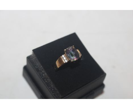 A 9ct gold ring set with multi coloured stones, and white stone set shoulders, ring size L/M, approx. 3.5gms total weight