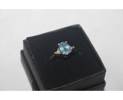 A white metal ring marked 950 set with topaz coloured stone and diamond set shoulders, ring size L/M, approx. 5.2gms