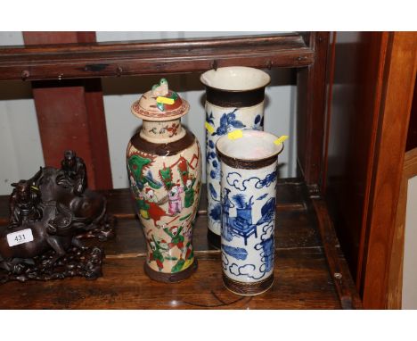 Two Chinese blue and white crackle glazed cylindrical vases decorated figures and objects, seal marks to base; and a crackle 