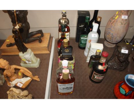 A collection of spirits to include Teachers Whisky, brandy, Cointreau, vodka etc.