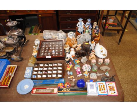 A quantity of various ornaments etc. to include thimbles, paper weights playing cards, harmonicas, book marks etc.