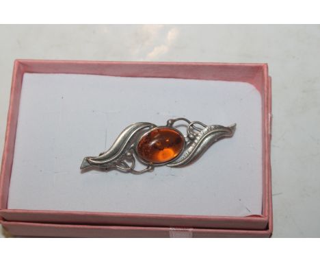 A vintage Sterling silver and amber set brooch 