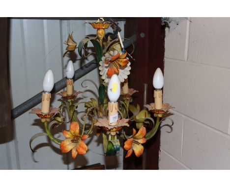 A decorative wrought metal five branch ceiling light 