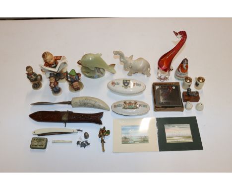 A box containing crested china, Goebel figures, photographic slides, cut throat razor etc.