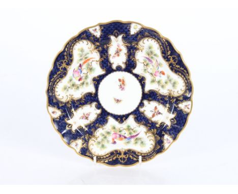 A Royal Worcester cabinet plate profusely decorated butterflies and birds on a blue scale ground, 22cm dia. 