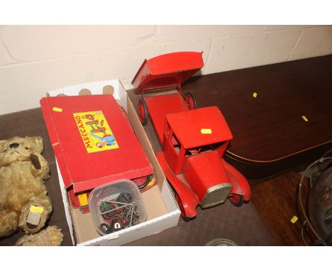 A vintage red tin plate tipper truck, Meccano items etc.
