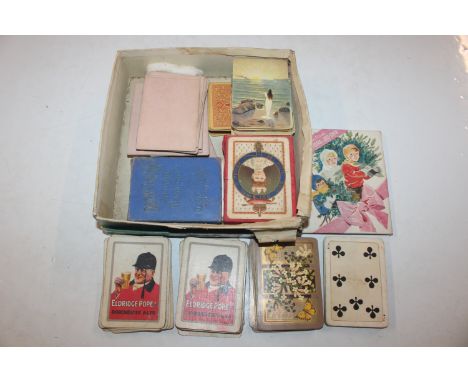 A box containing vintage and other playing cards including photographic Valentines postcard jig-saw