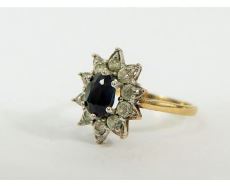 9ct Yellow Gold ring set with a large White Sapphire with Diamond surround.  Finger size 'M' 3.0g