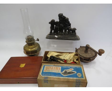 Mixed lot to include a oil lamp, cast iron door stop, knife sharpner etc.
