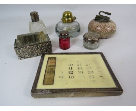 Interesting mixed lot to include scent bottles, calendar, glass roller and inkwell, most with silver lids, surrounds.