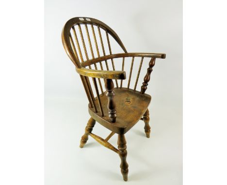 Well made Oak Childs size Windsor stick chair with turned legs.  Seat height 11 inches,  Height to back 24 inches. See photos