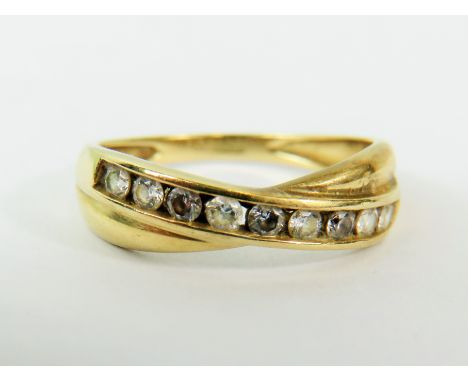 14ct  Yellow Gold CZ set crossover ring.   Finger size 'Q-5 to R'   2.7