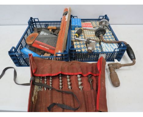 Various tools, drill bits and a selection of screws.