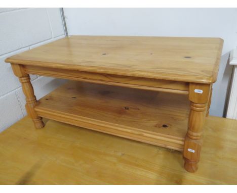 Solid knotty pine table with handy shelf under. Measures approx H:18 x W:39 x D:22 Inches. See photos. S2