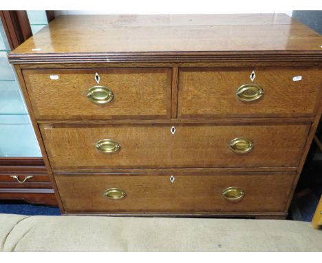 Oak Chest with brass handes.  Raised on Bracket feet it measures approx H:35 x W:39 x D:19 inches.   See photos.   S2