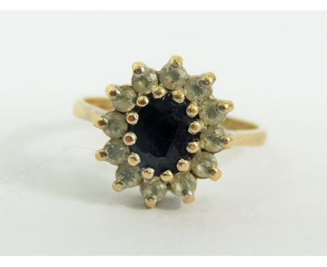 9ct Yellow Gold ring set in a Flower pattern.   Finger size 'N-5'  2.8g