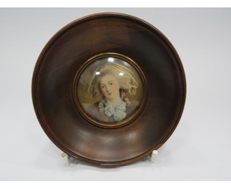 Small framed miniature portrait, frame measures 9.5cm diameter.