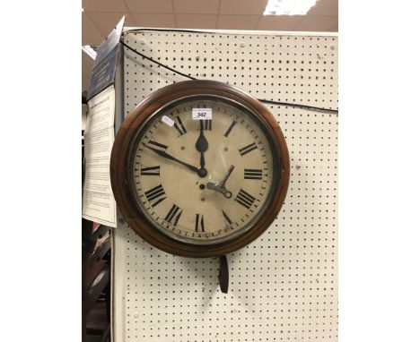 A 19th Century mahogany framed wall dial, the chapter ring with Roman numerals, with single fusee movement, 38 cm diameter