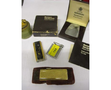 Five vintage lighters to include a Colibri Supertronic in case, a Roller Beacon 'From Chunky' lighter and a Ronson Varatronic