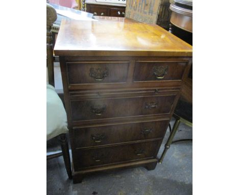 A reproduction yew wood small chest of two short and three long drawers having a brush slide and bracket feet 30"H x 19"W 
