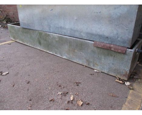 A galvanized feed trough 