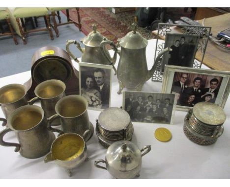 Mixed silver plate, photograph frames and a small mahogany mantle clock 