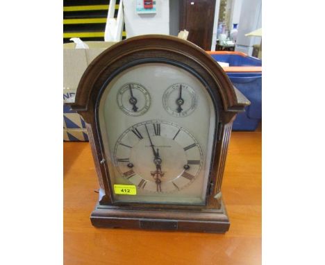 An Ollivant &amp; Botsford, Manchester, early 20th century mahogany cased bracket clock presentation plaque to the front date