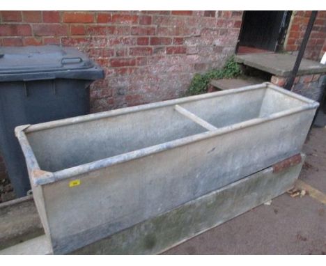 A galvanized feed trough 