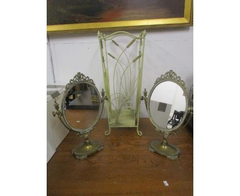 A pair of modern brass swing pedestal mirrors and a cream painted metal stick stand 