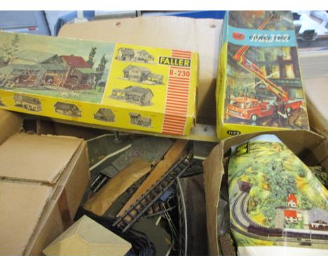 A quantity of 00 gauge track and accessories together with an empty vintage Corgi Fire Engine box 