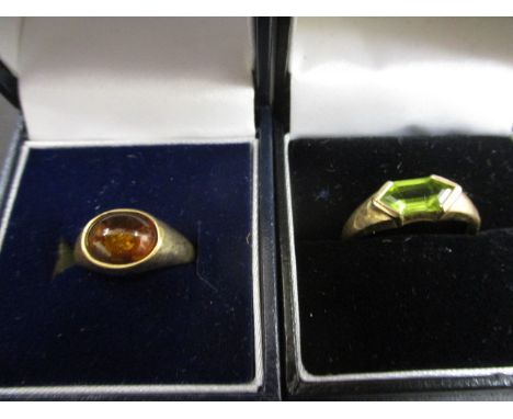 A 9ct gold ring set with a green stone and a yellow metal ring stamped 375 