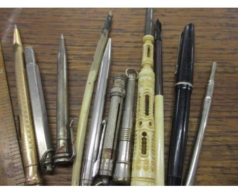 Vintage pens and propelling pencils to include an ivory handled and silver plated example, together with a ruler 