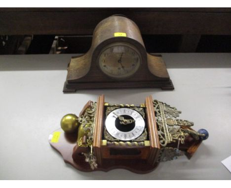 A wall hanging clock with brass fittings and an early 20th century oak cased  mantel clock 