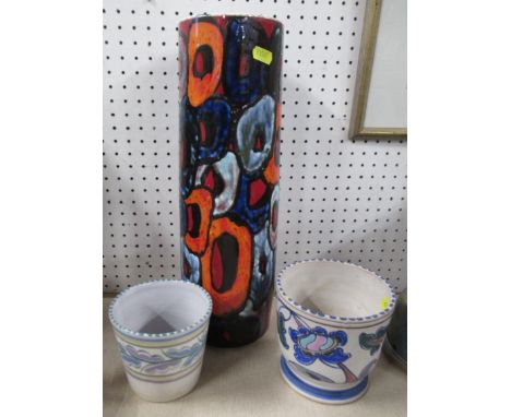 A Poole cylindrical vase, together with two other vases