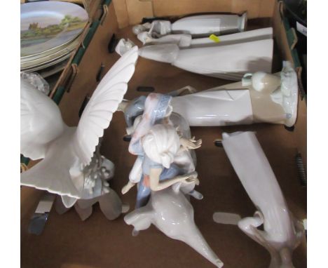A collection of Lladro and Nao figures